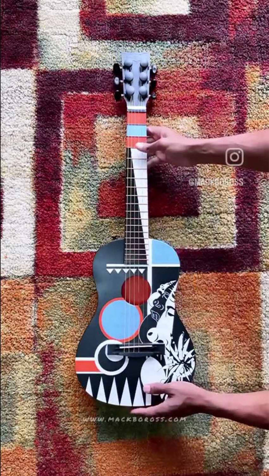 Guitar design by Wisconsin based Artist Mack Bo Ross using posca pens