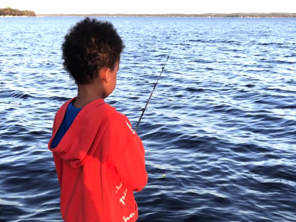Family fishing trip up north with children enjoying a peaceful day by the water