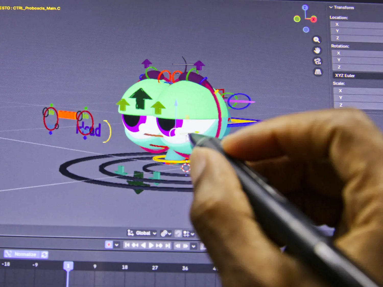 Close-up of the Pesto character being re-rigged in Blender for the Monty and Pesto animated series, with a stylus and rig controls visible.