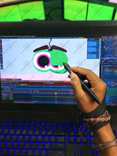 Artist Mack Bo Ross working on an animation project in the studio, focused on the creative process.
