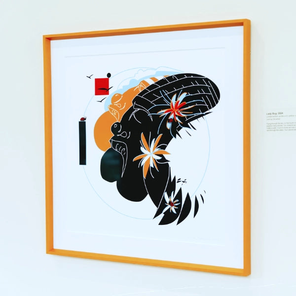 Framed abstract artwork with black silhouette, flowers, and geometric shapes on a white background