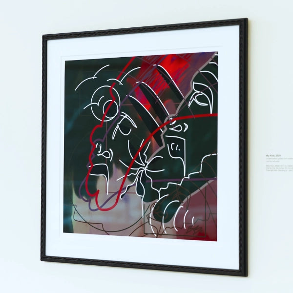 Framed abstract artwork with red, black, and white lines on a light gray wall.